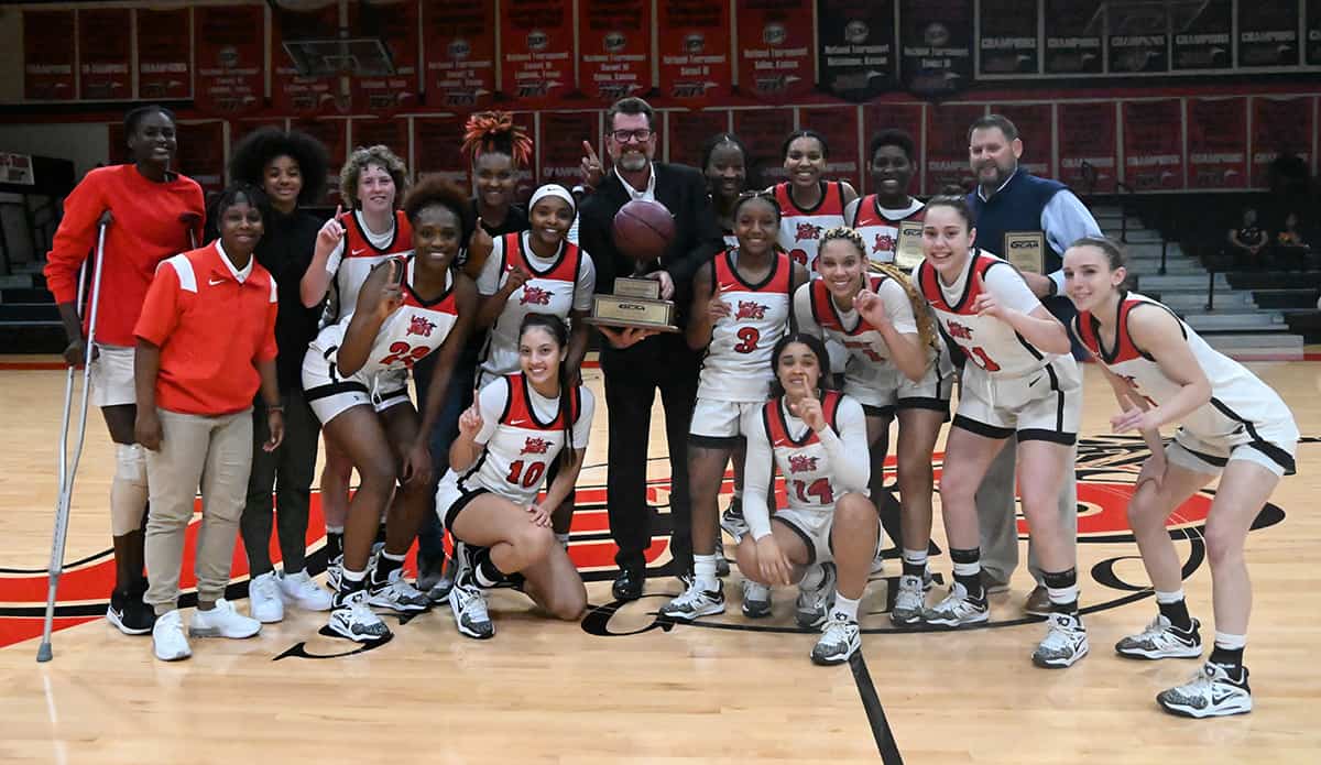 South Georgia Technical College President Dr. John Watford is shown above with the NJCAA Region XVII Champion Lady Jets and their coaching staff.