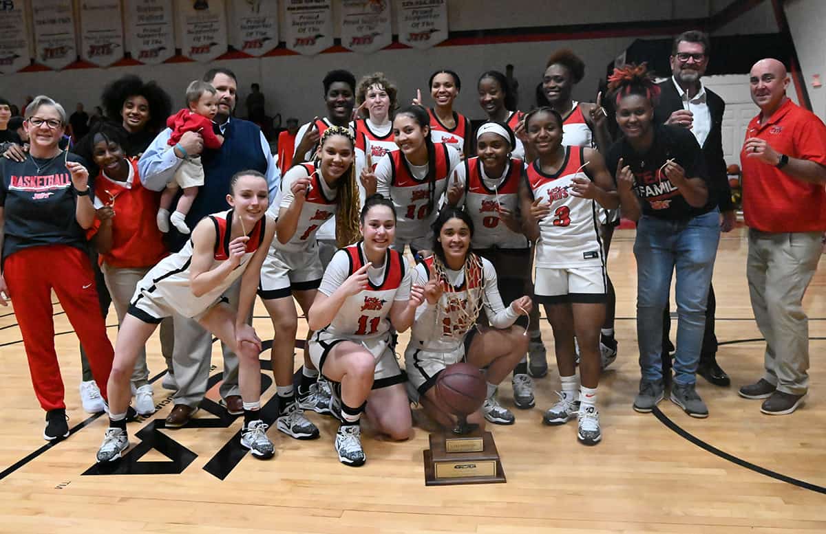 South Georgia Technical College President Dr. John Watford is shown above with the NJCAA Region XVII Champion Lady Jets and their coaching staff.
