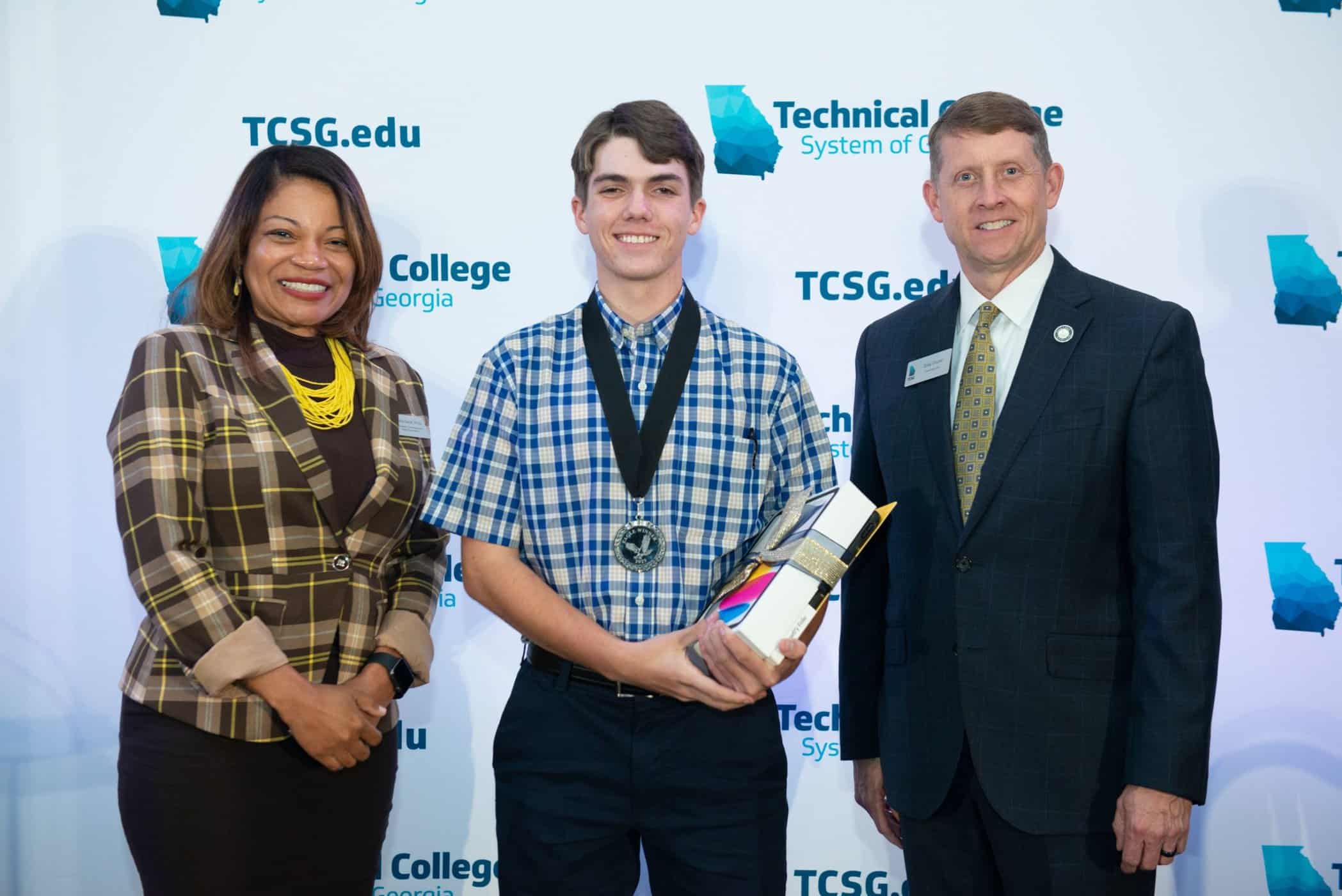 SGTC Commissioner Greg Dozier (right) is shown above with SGTC EAGLE student Zackary Mincey of Buena Vista (center) and Dr. Cayanna Good, TCSG Assistant Commissioner for Adult Education(left).