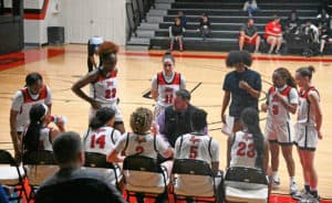 SGTC head coach James Frey calls a timeout to talk with his team during the East Georgia Region XVII finals.