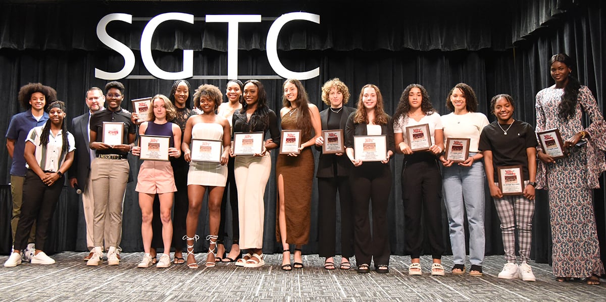 SGTC Lady Jets head coach James Frey along with assistant coaches Olivia Melvin and Ricka Jackson are shown with the members of the 2022 – 2023 Lady Jets with their plaques.