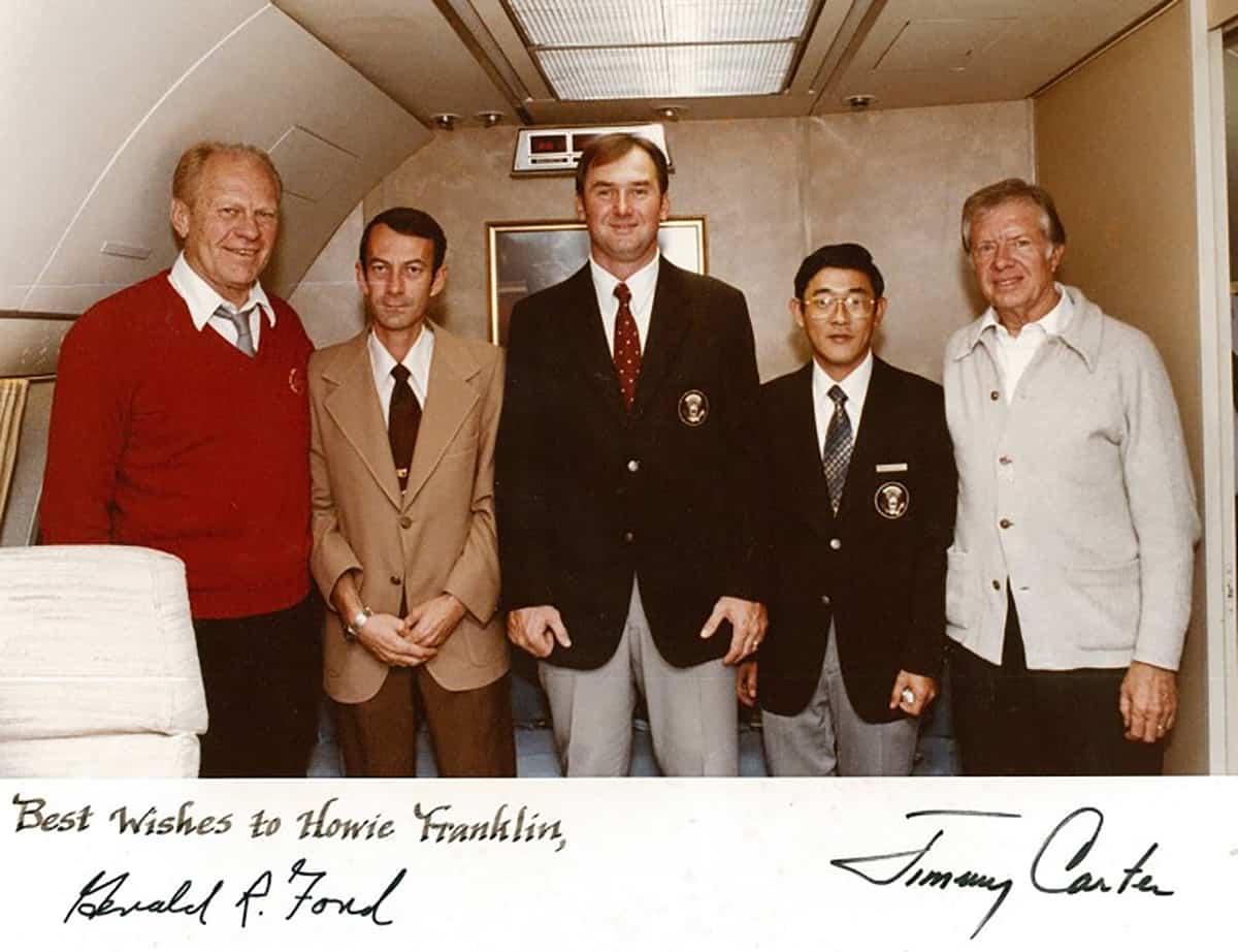 Howie Franklin (center) is shown with President’s Ford and Carter and other dignitaries aboard Air Force One.
