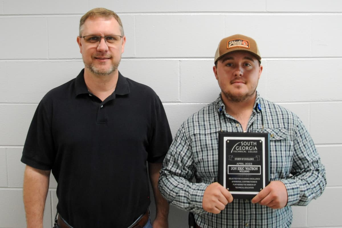 SGTC Crisp County Center Student of Excellence Jon Eric Watson (right) with Welding instructor Brad Aldridge.