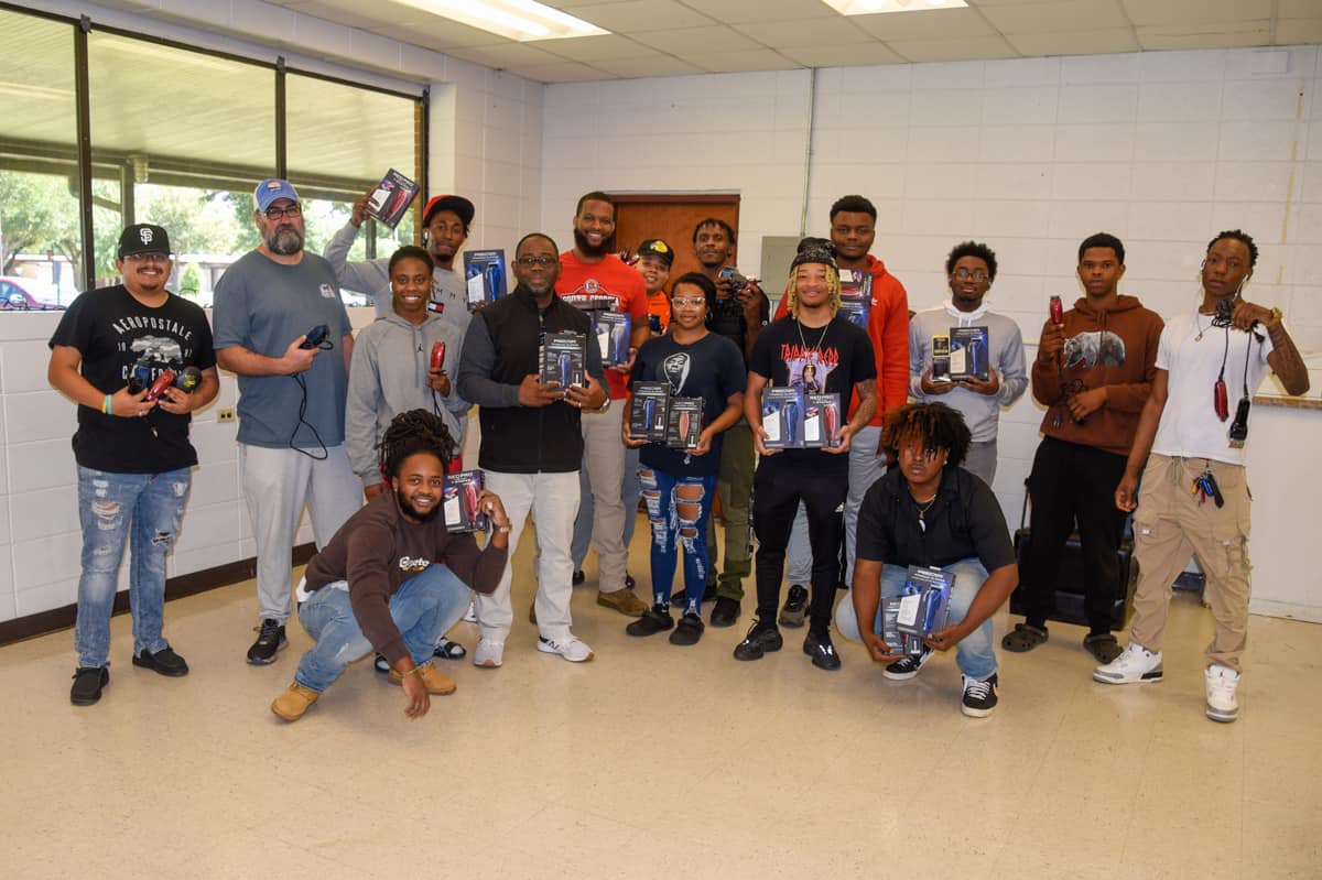 Shown above are SGTC Barbering students with instructor Andre Robinson with the Red Beauty Red Edgelining T-shaper Hair Trimmers and the Red Pro Edgelining Titanium Clippers.