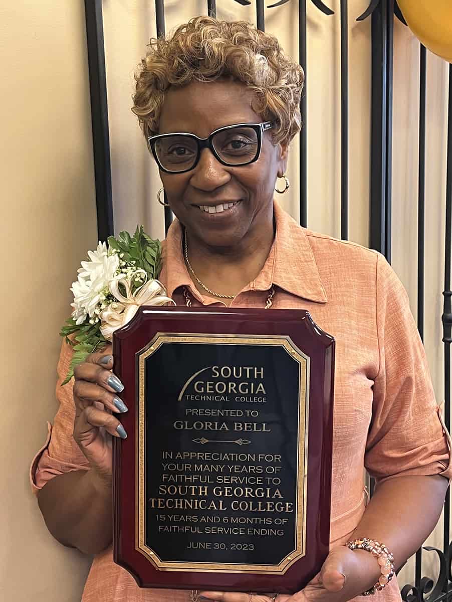 Gloria Bell is shown above with her plaque for 15-years and six months of service to South Georgia Technical College.