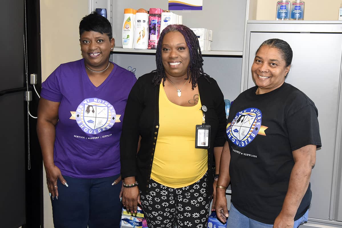 SGTC Special Services Coordinator Jennifer Robinson (center) is pictured in the Jets Pantry with Claudia Phillips (left), founder of On My Mother’s Shoulders, and volunteer Mona Williams.