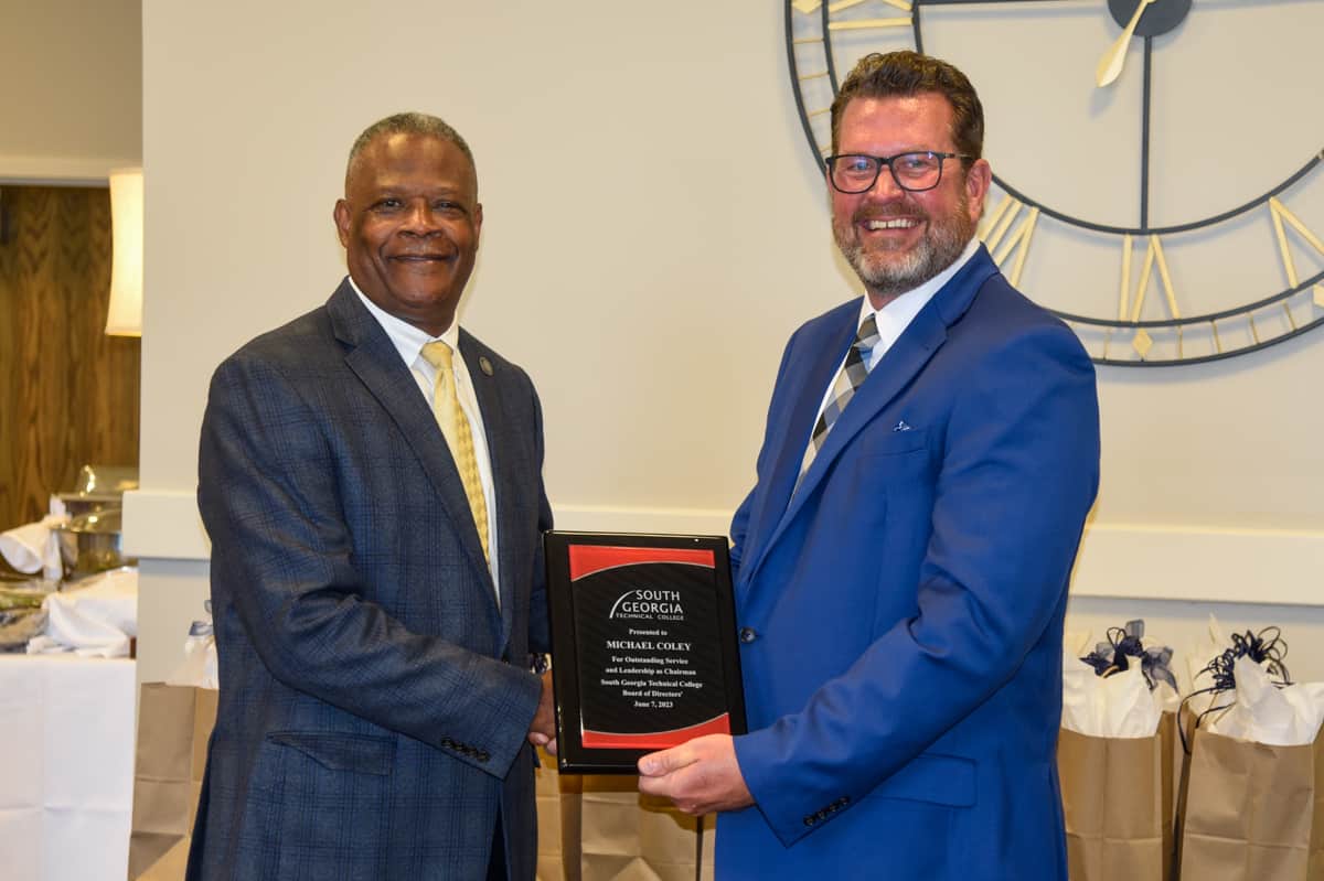 SGTC President Dr. John Watford (right) is shown above presenting outgoing SGTC Board of Directors Chair Michael Coley (left) with a token of appreciation for his service as Chair of the Board for the 2022 – 2023 year.