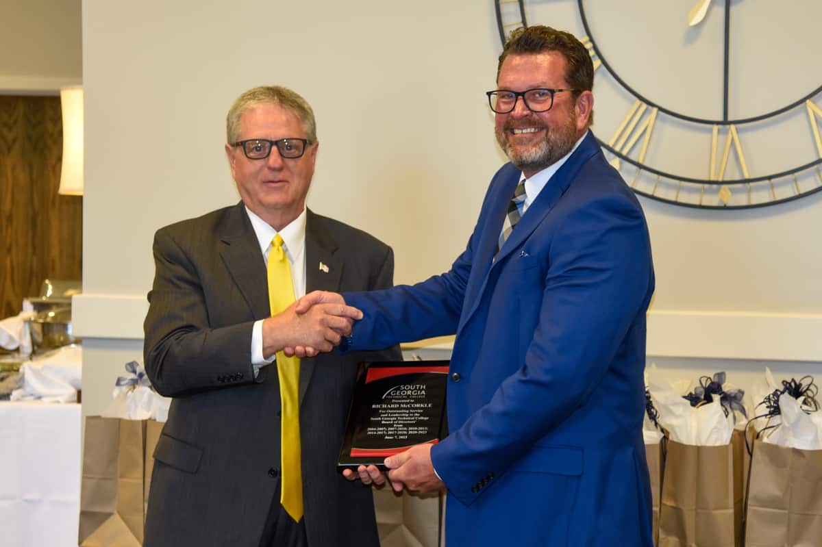 SGTC President Dr. John Watford (right) is shown above presenting outgoing SGTC Board of Directors long-time member Richard McCorkle (left) with a plaque of appreciation for his service to the Board.
