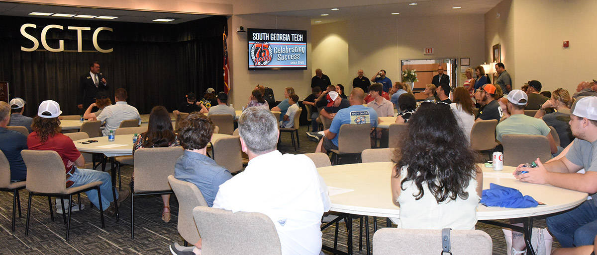 South Georgia Technical College President Dr. John Watford is shown talking to the nearly 100 individuals that were involved in the SGTC-Caterpillar Orientation/Registration Day for Fall Semester 2023.