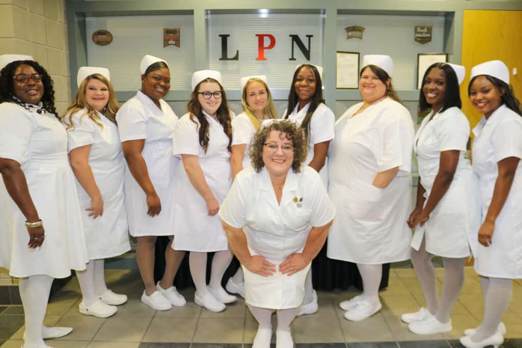 SGTC Crisp County Practical Nursing instructor Brandy Patrick (front) is pictured with graduates of the program at a recent pinning ceremony on the Cordele campus.