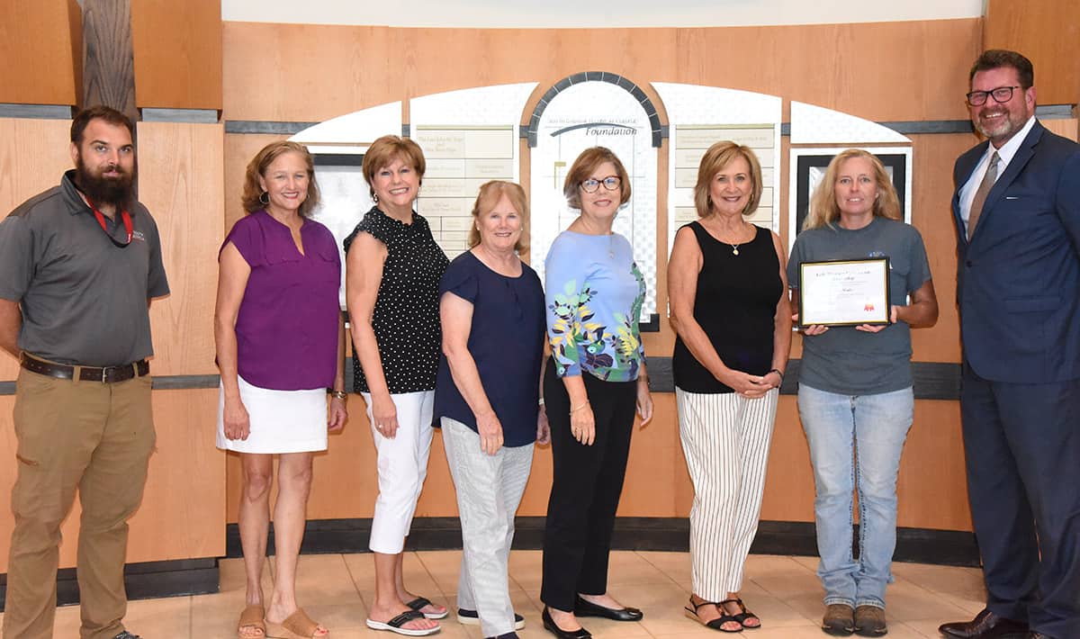 South Georgia Technical College Environmental Horticulture Instructor Brandon Gross is shown above (l to r) with Early Bloomers Garden club members Deanna Pope, Reda Rowell, Pam Smith, Sybil Smith, Mary Len Walker, scholarship recipient Lisa Wade, and SGTC President Dr. John Watford.