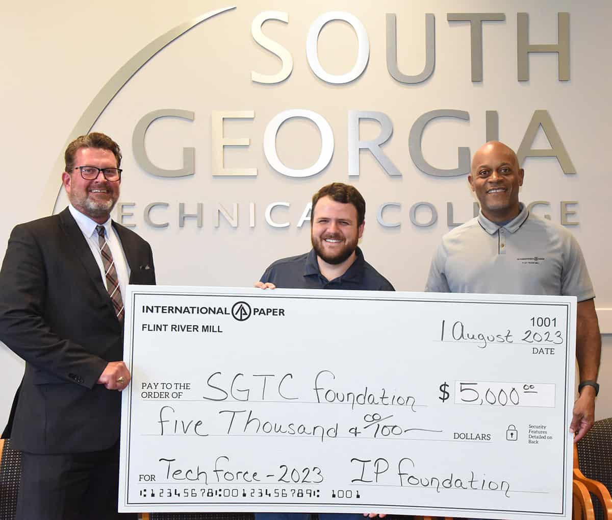 South Georgia Technical College President Dr. John Watford is shown above receiving a grant donation from International Paper Flint River Mill from IP Flint River Mill Communications Coordinator Caleb Mims and IP Flint River Mill Manager John Nixon.