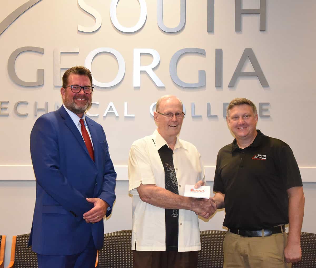 South Georgia Technical College President Dr. John Watford (l) is shown above with GSRA President Mickey White (c) who is presenting SGTC High Performance Engines/Motorsports Instructor Kevin Beaver with $1500 worth of Summit Racing Gift Cards for the program to utilize on tools and equipment.