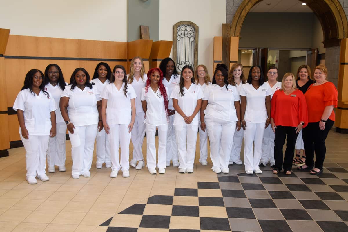 LPN Graduates 8-23: Pictured (from right) are SGTC Nursing instructors Jennifer Childs, Raissa Welch, and Christine Rundle with LPN graduates at the recent pinning ceremony.