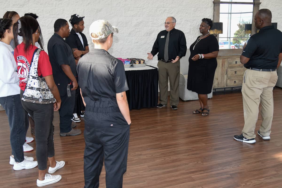 South Georgia Technical College Academic Dean Dr. David Finley (center) addresses students at a recent “Meet the Dean” reception on the Americus campus. Also pictured are SGTC Marketing instructor Mary Cross and Auto Collision Repair instructor Starlyn Sampson.