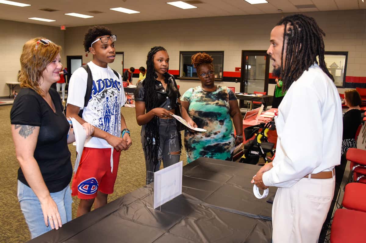 SGTC Mathematics instructor Chester Taylor (right) tells students about the benefits of being a member of the National Technical Honor Society.