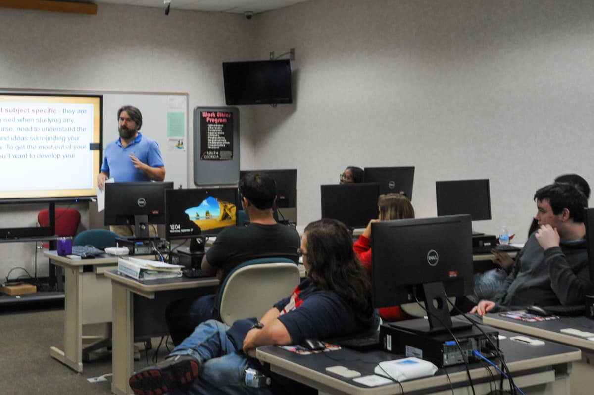 SGTC Crisp County Center Media and Library Services Specialist D.W. Persall (left) conducts a workshop for students on effective studying skills.