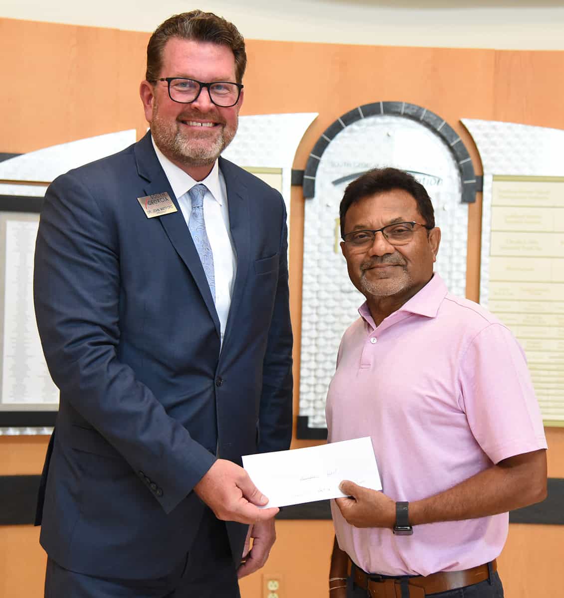 South Georgia Technical College President Dr. John Watford (l) is shown above thanking Sharad Patel for his contributions to the South Georgia Technical College Foundation.