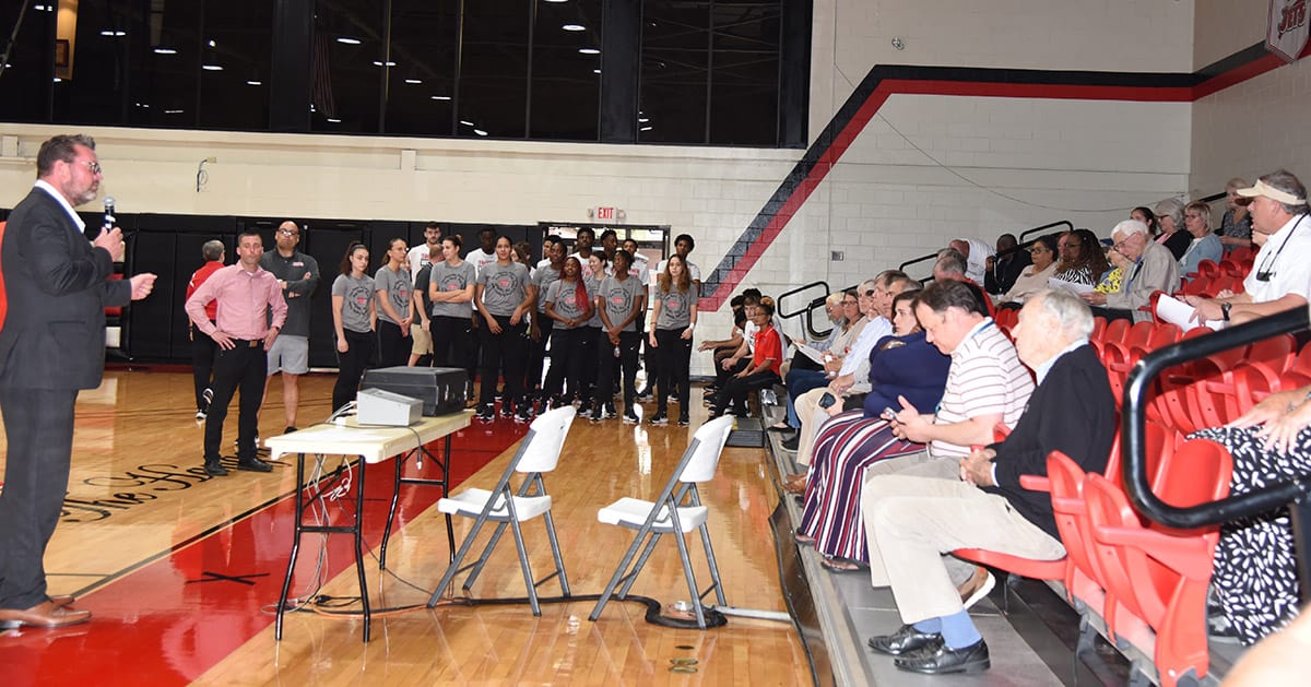 SGTC President Dr. John Watford is shown above welcoming individuals to the 2023 – 2024 Jets Kickoff event in the SGTC gymnasium.