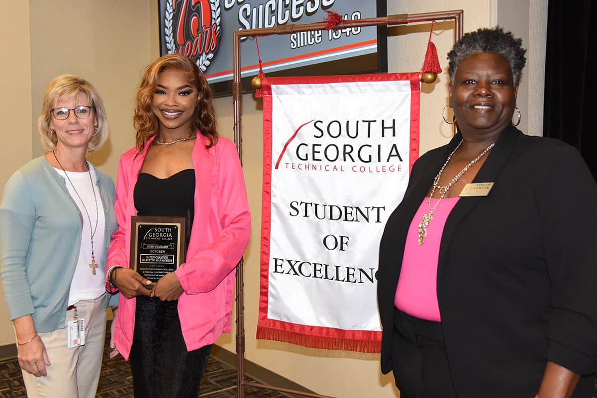 Marketing Management student Katlin Champion (center) of Americus, was selected as the SGTC overall Student of Excellence for October. Shown with her are SGTC Vice President of Academic Affairs Julie Partain (left) and Marketing Management Instructor Mary Cross (right).