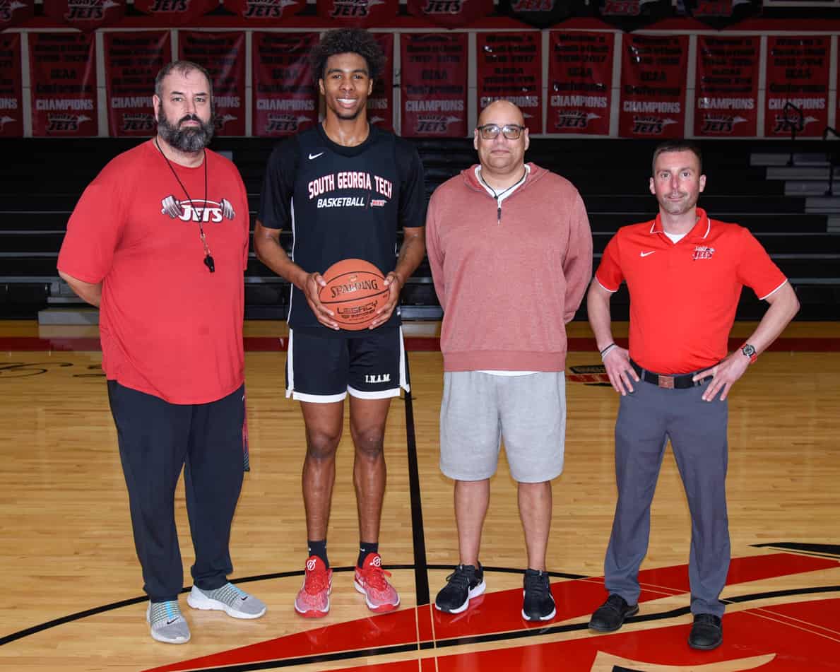 Pictured (l-r) are Jets Head Basketball Coach Chris Ballauer, Jafeth Martinez, Jets Assistant Coach George Ross Jr., and SGTC Athletic Director and Lady Jets Head Coach Jason Carpenter.