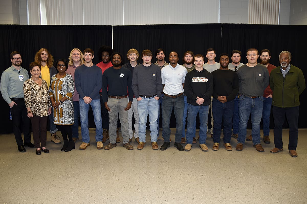 Johnathan Hobgood, Lillie Ann Winn, and Cynthia Carter (front l-r) conducted mock interviews with SGTC Electrical Lineworker Apprentice students, pictured here with their instructor, Sidney Johnson (r).