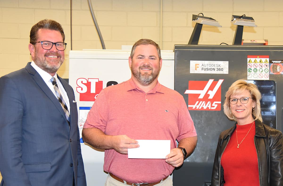 South Georgia Technical College President Dr. John Watford (left) is shown above with SGTC Precision Machining and Manufacturing Instructor Chad Brown, (center) and SGTC Vice President of Academic Affairs Julie Partain with the Gene Haas donation to the SGTC Foundation.