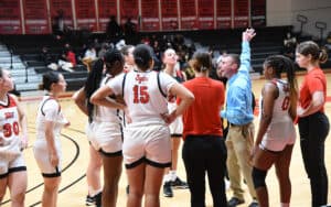 Head coach Jason Carpenter is shown above talking with the Lady Jets during a timeout.
