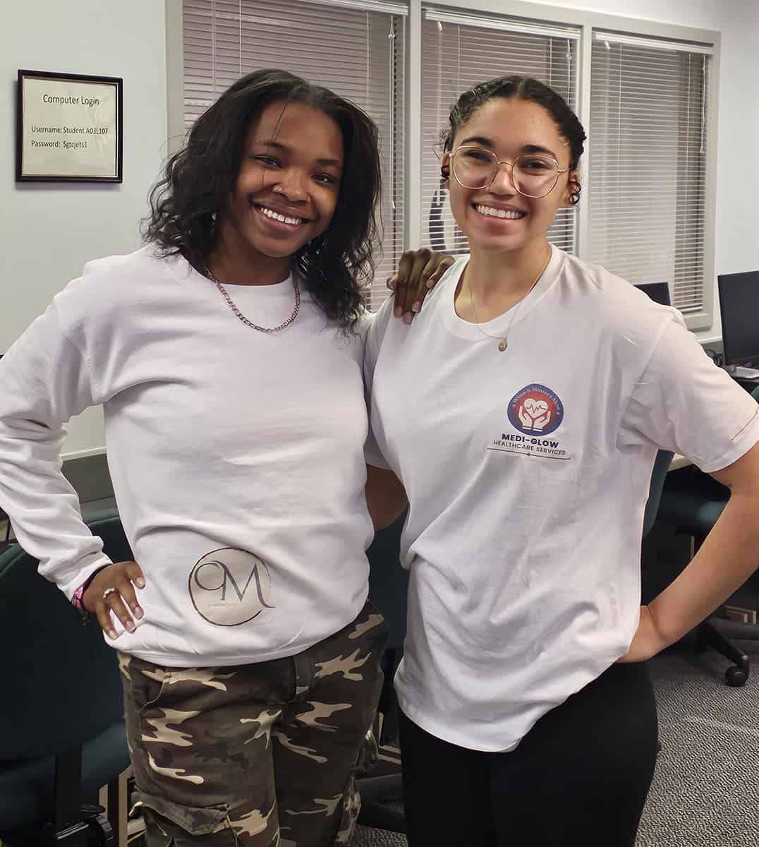 SGTC Marketing students Kaitlin Champion and Leah Nunley are shown above wearing apparel with logos they created for their future businesses.