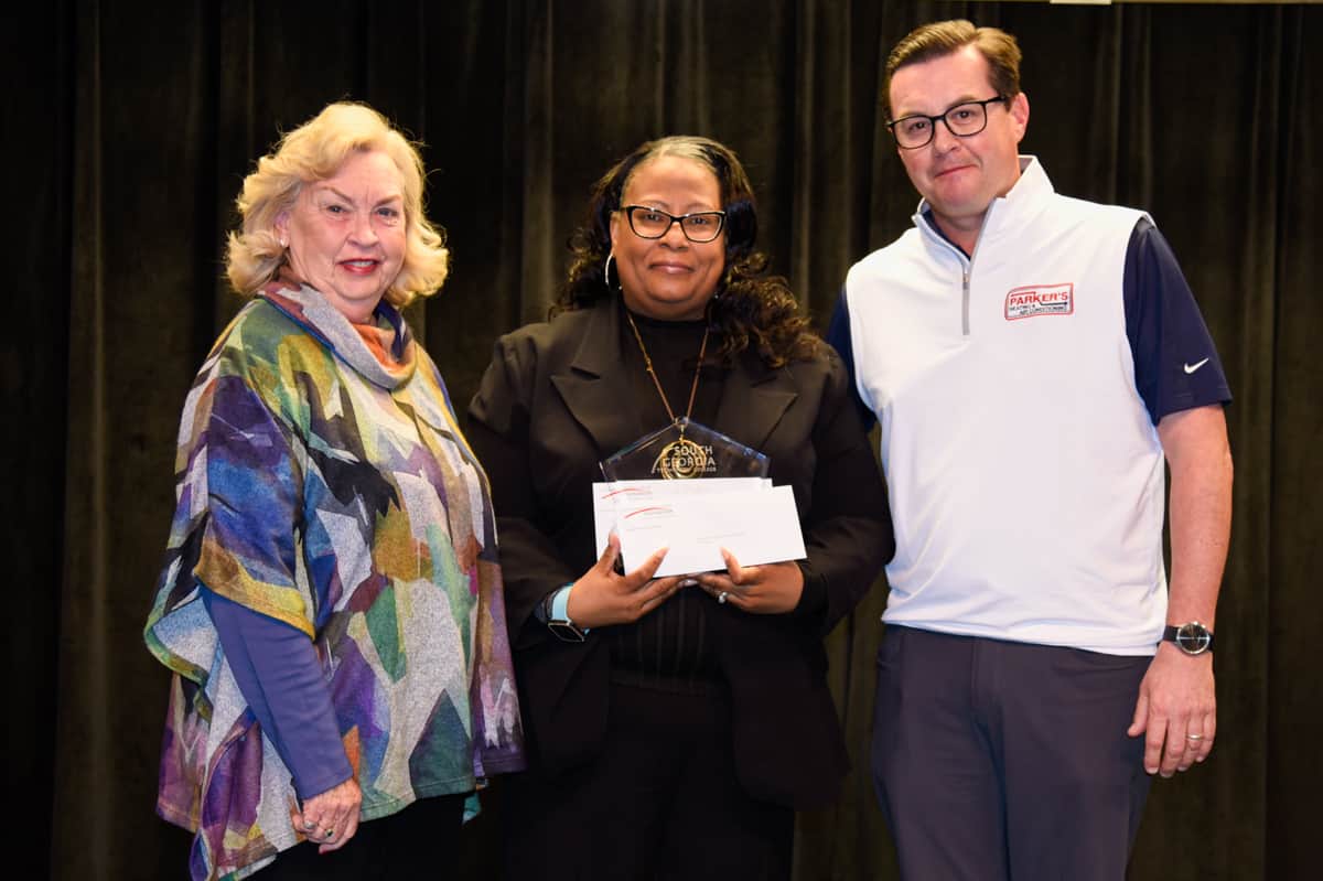Allene Reeves(left) and Kevin Reeves (right) are shown above presenting Dr. Seay (center) with a check for being named SGTC 2024 Instructor of the Year.
