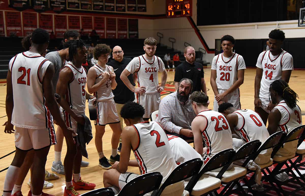 SGTC Jets head coach Chris Ballauer is shown above during a timeout with his team.
