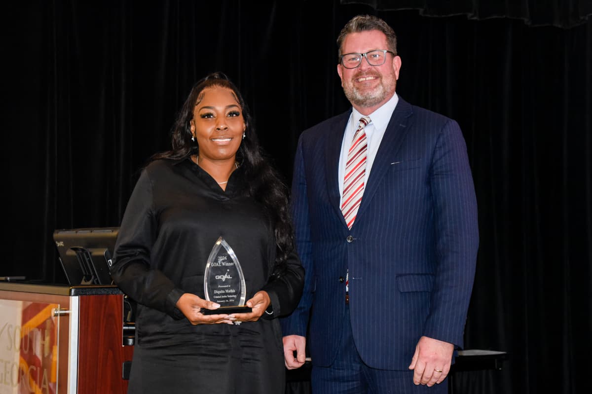Pictured (l-r) are SGTC 2024 GOAL winner Diquita Mathis, a Criminal Justice student from Pinehurst, with SGTC President Dr. John Watford.