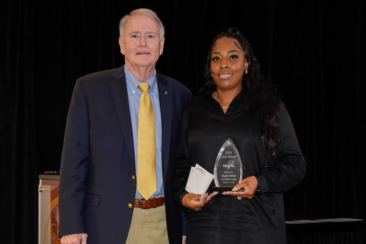 Americus Rotary Club member and Past President Don Smith (l) is shown above presenting a check from the Rotary Club to Diquita Mathis (r), who was selected as the SGTC 2024 GOAL student of the year.