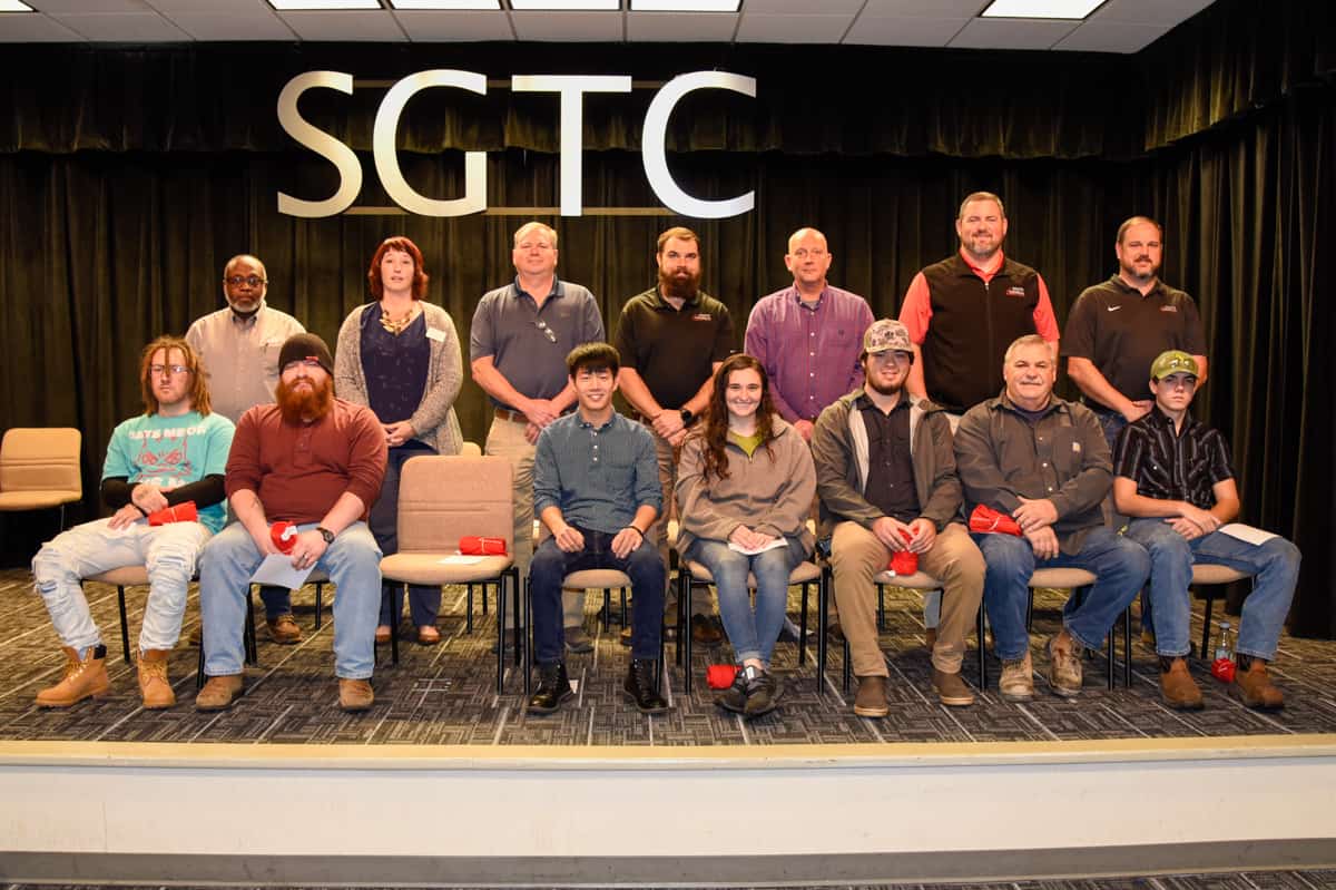 Pictured are nominees for SGTC Student of excellence and their instructors. Seated (l-r) are Christopher Davis, Alexander Edmondson, Joseph Jolly, Ariel Hudson, Larson Newsome, Robert Brown Jr., and Zackary Mincey. Standing (l-r) are instructors Johnny Griffin, Kristie Hudson, Mike Collins, Brandon Gross, Patrick Owen, Chad Brown, and Ted Eschmann. Not pictured is nominee Quentin Edwards.