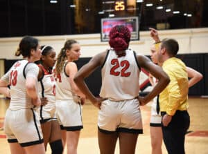 SGTC head coach Jason Carpenter talks with team during timeout.