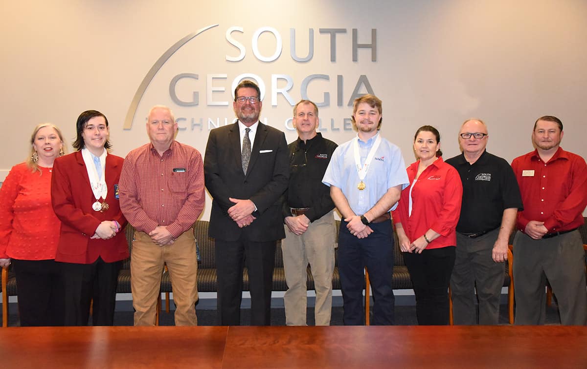 South Georgia Technical College President Dr. John Watford (fourth from left) is shown above with the SGTC Georgia SkillsUSA GOLD medal winners and instructors. They are Teresa McCook and her Criminal Justice Gold Medal winner Brantley Vansickle, Aviation Maintenance instructor David Grant, President Watford, Aviation Maintenance Instructor Paul Pearson, GOLD medal Aviation Maintenance winner Andrew Daniel and Aviation Maintenance Instructors Victoria Herron, Charles Christmas and Robert Sturgeon. Not shown are Precision Machining and Manufacturing instructor Chad Brown and his Gold medal winner Blake Archer.