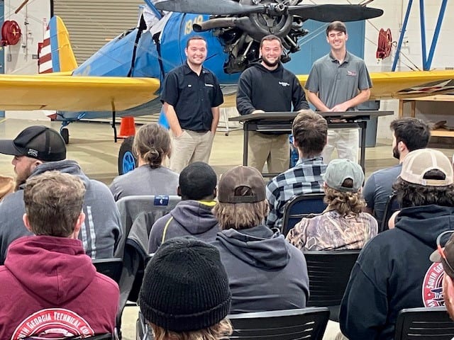 SGTC aviation maintenance technology graduates Kip and Kolby McClelland and Ryan Carter are shown above talking with current SGTC AVMT students in the Griffin B. Bell Aerospace Center at South Georgia Tech.