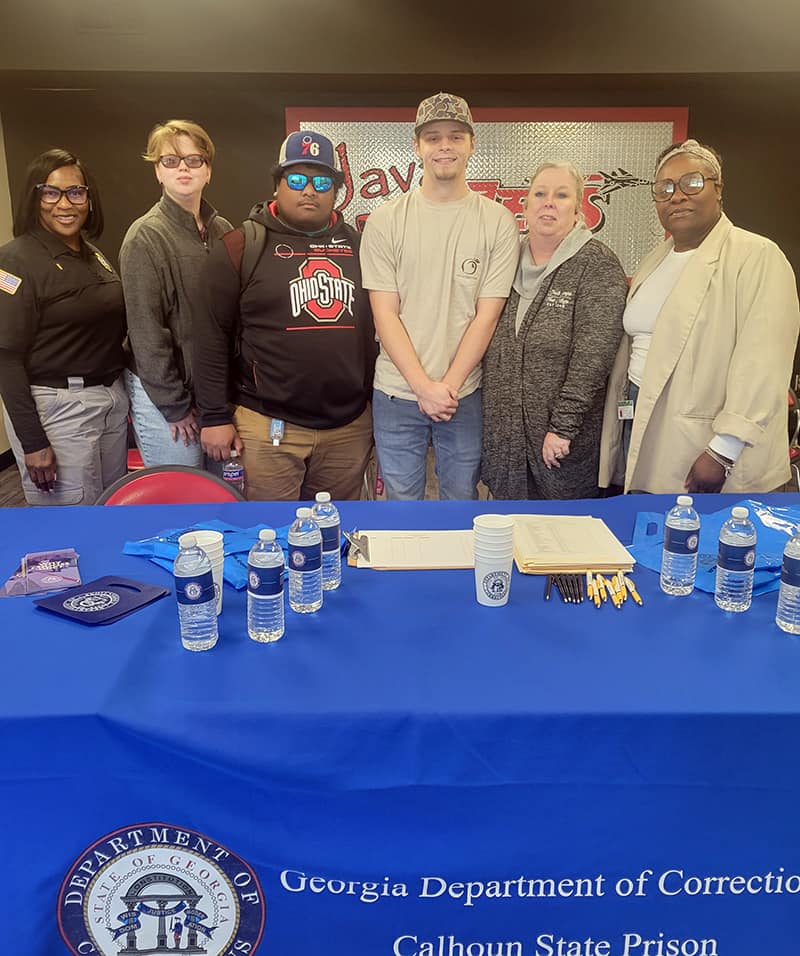 Pictured (outside left and right respectively) are Recruitment Lt. Debra Jones and Recruiter Jewell Furtado of the Georgia Department of Corrections with SGTC Criminal Justice instructor Teresa McCook (second from right) and three of her students.