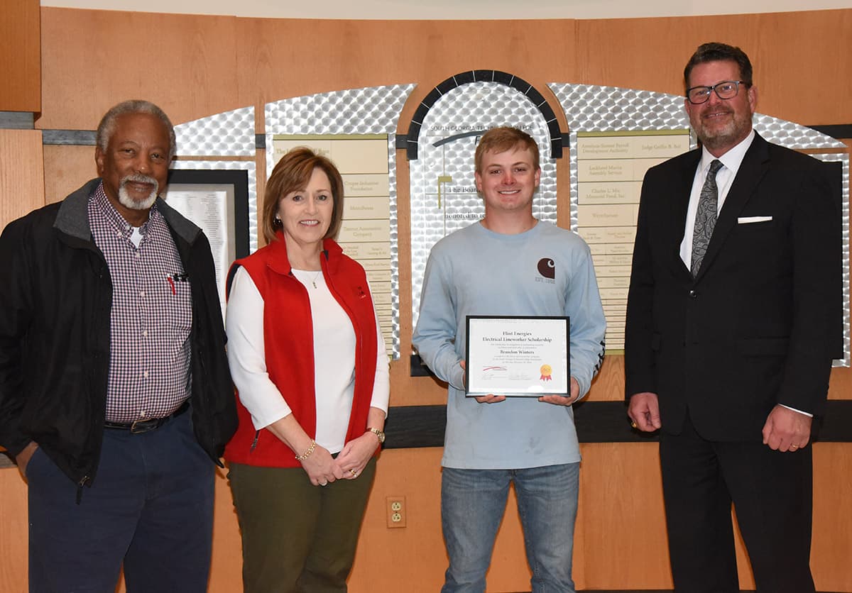 Shown above (l to r) are South Georgia Technical College Electrical Lineworker Instructor Sidney Johnson, Economic Development Assistant and Partnership Coordinator Tami Blount, Scholarship winner Brandon Winters and SGTC President Dr. John Watford.