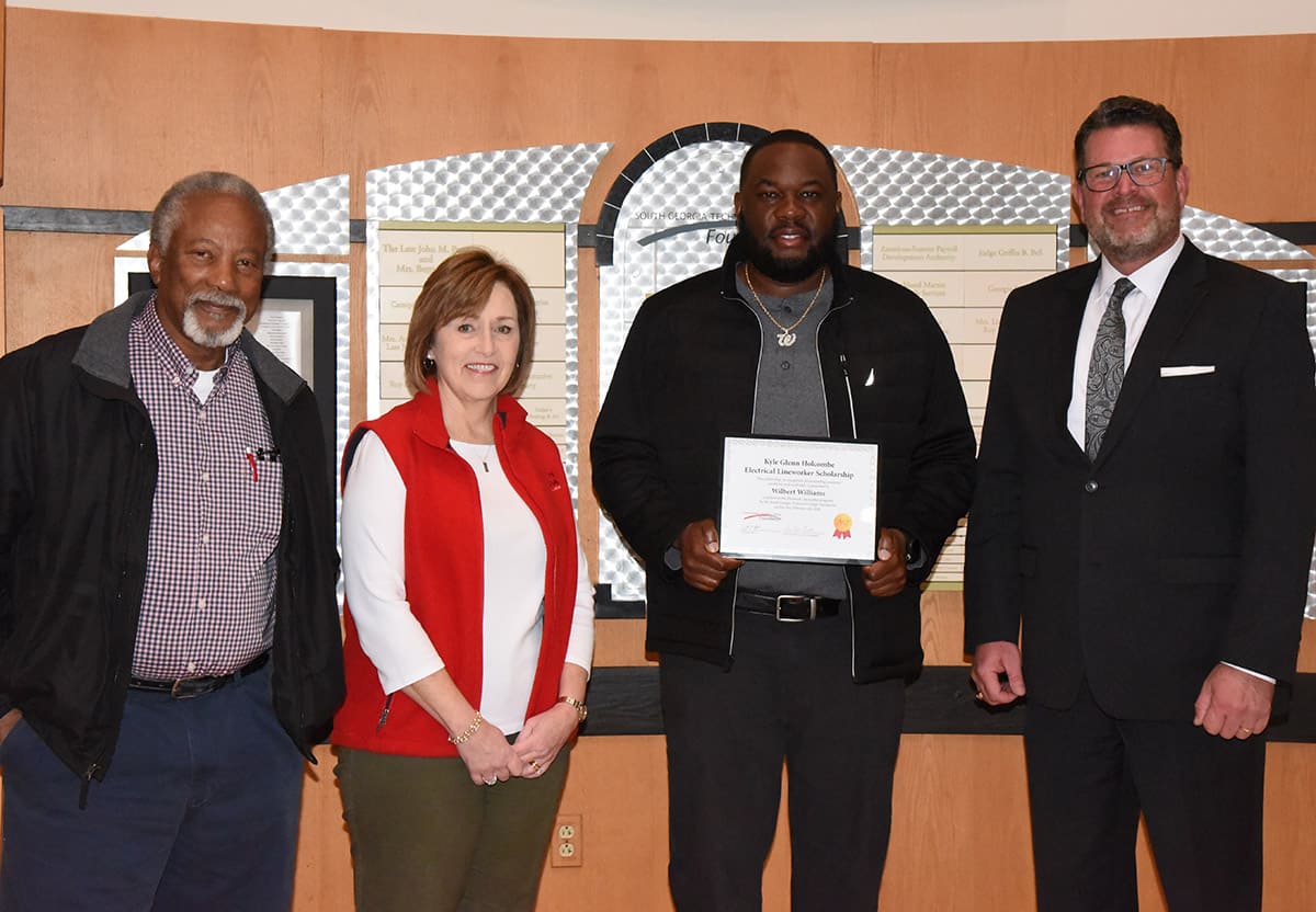 South Georgia Technical College Electrical Lineworker Instructor Sydney Johnson, SGTC Economic Development Assistant and Partnership Coordinator Tami Blount are shown above with Kyle Glenn Holcombe scholarship winner Will Williams and SGTC President Dr. John Watford.