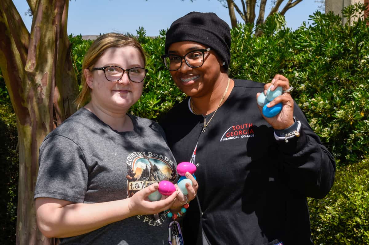 Two SGTC students show off their Easter egg haul during the recent Spring Spectacular event on campus.