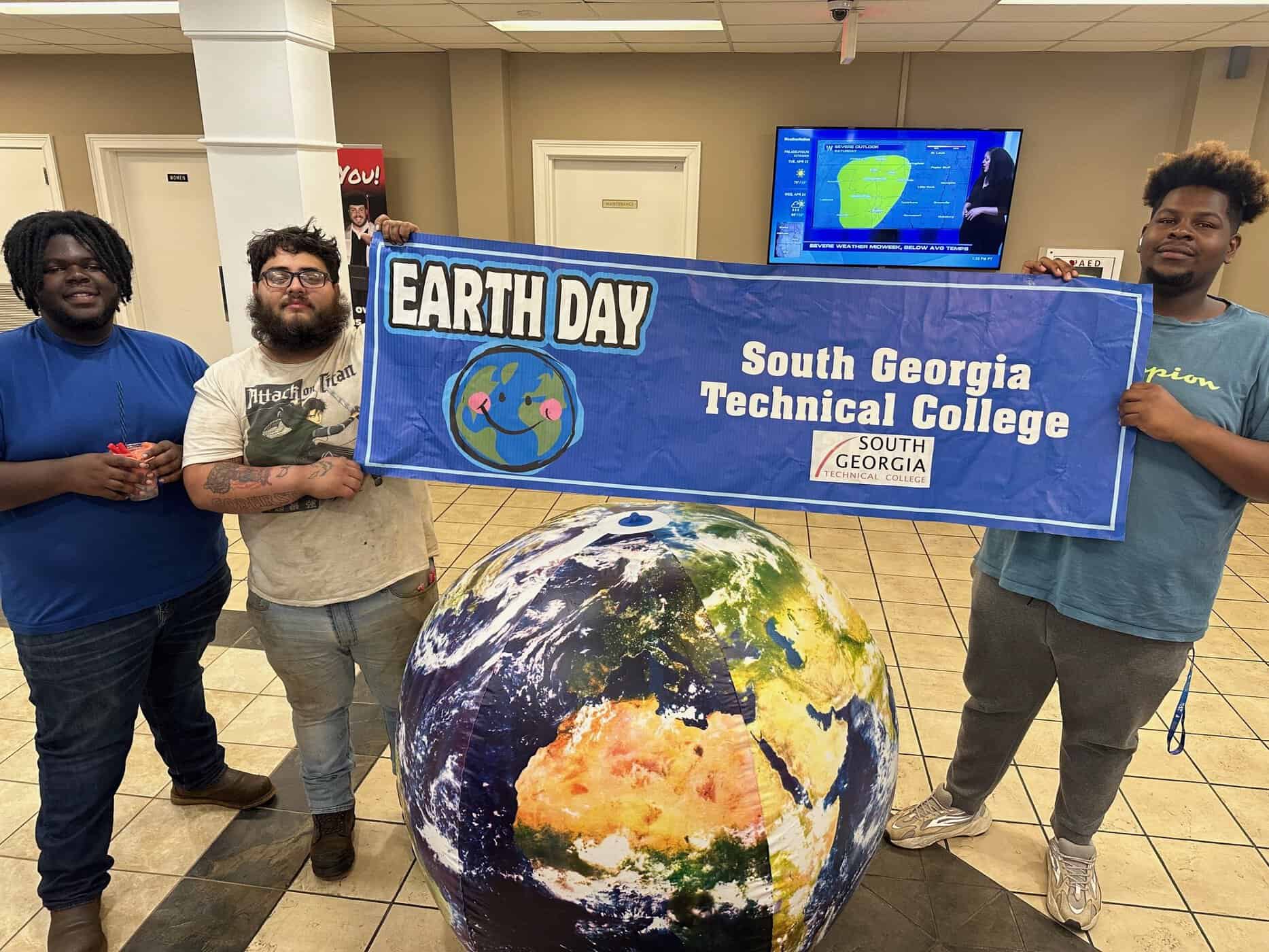 SGTC students are shown above setting up for the Earth Day celebration.