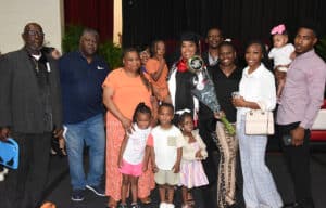 Diquita Mathis, the SGTC graduation speaker and SGTC 2024 GOAL winner, is shown after receiving her Criminal Justice Associate Degree with her family members that came to support her.
