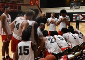 The Jets huddle up before returning to play.