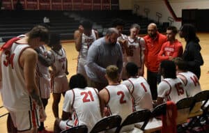 SGTC Head coach Chris Ballauer is shown above talking with Jets during timeout.