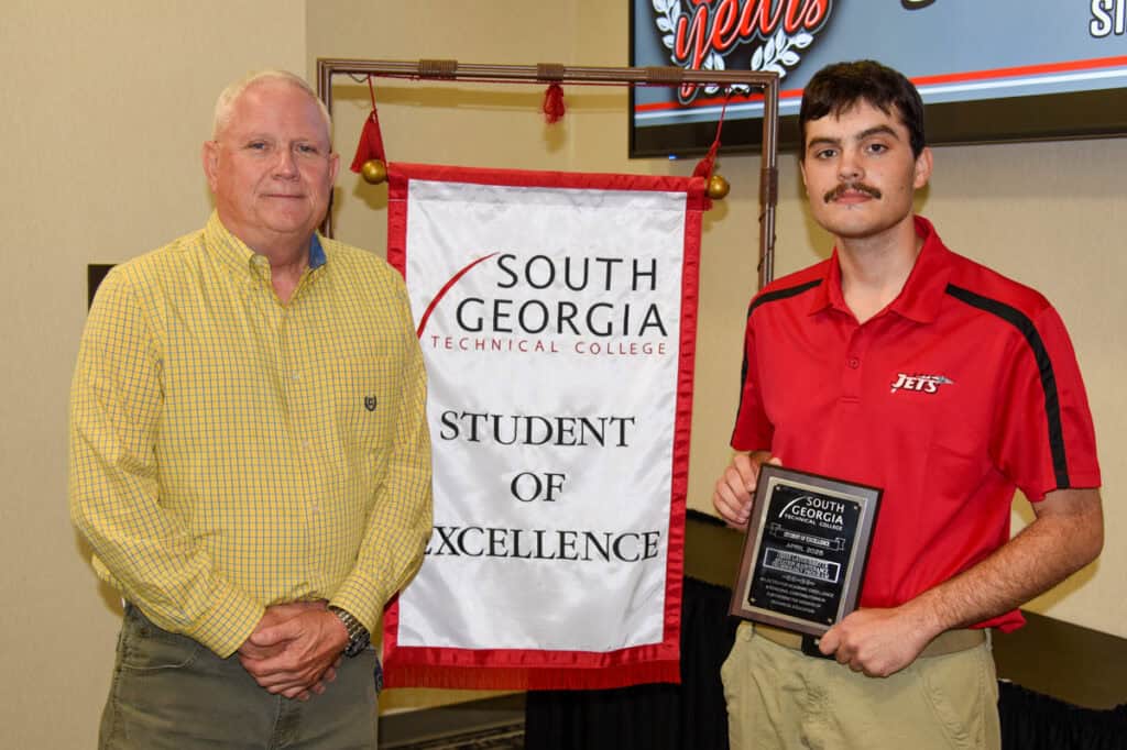 SGTC Student of Excellence Jesse Latourrette (right) with Aviation Maintenance instructor David Grant.