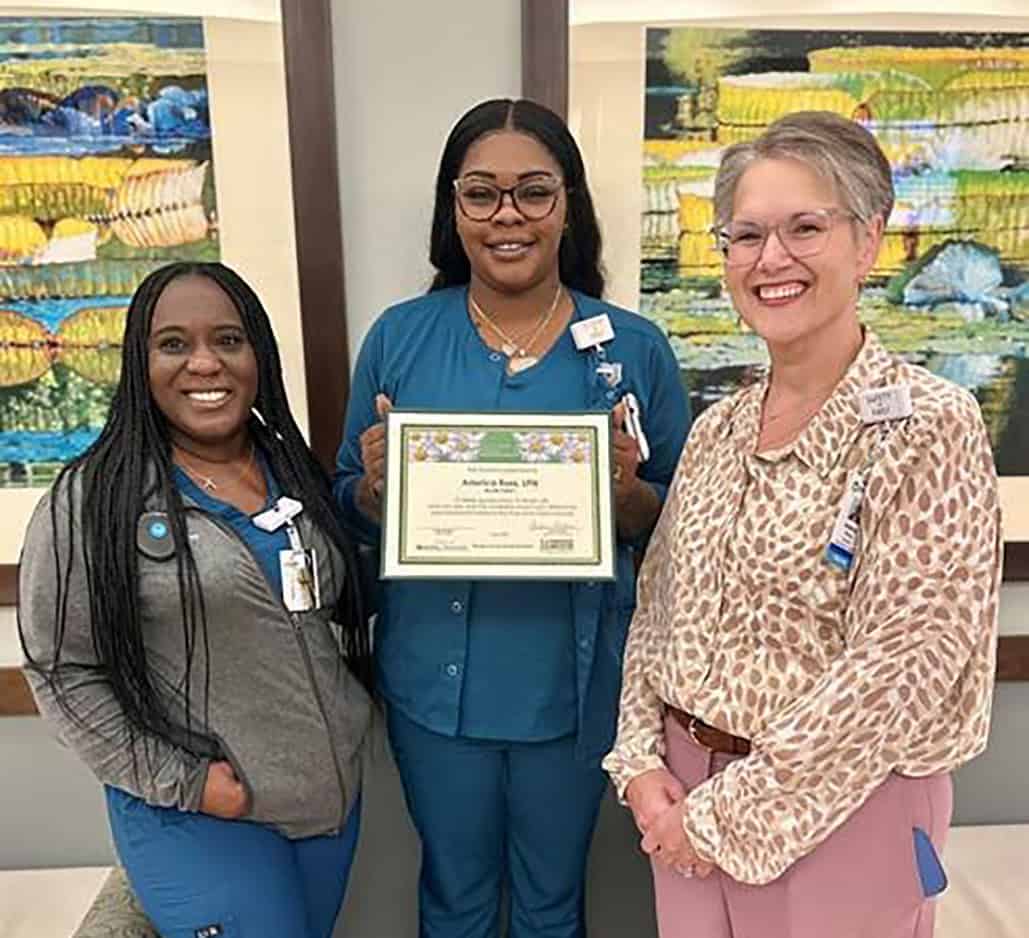 Aderica Ross (c) is shown above with her “Daisy of the Day” certificate from Phoebe Sumter Medical Center.