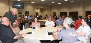 SGTC Heavy Equipment Dealer Service Technology Instructor Don Rountree is shown above talking to new CAT students and their parents.