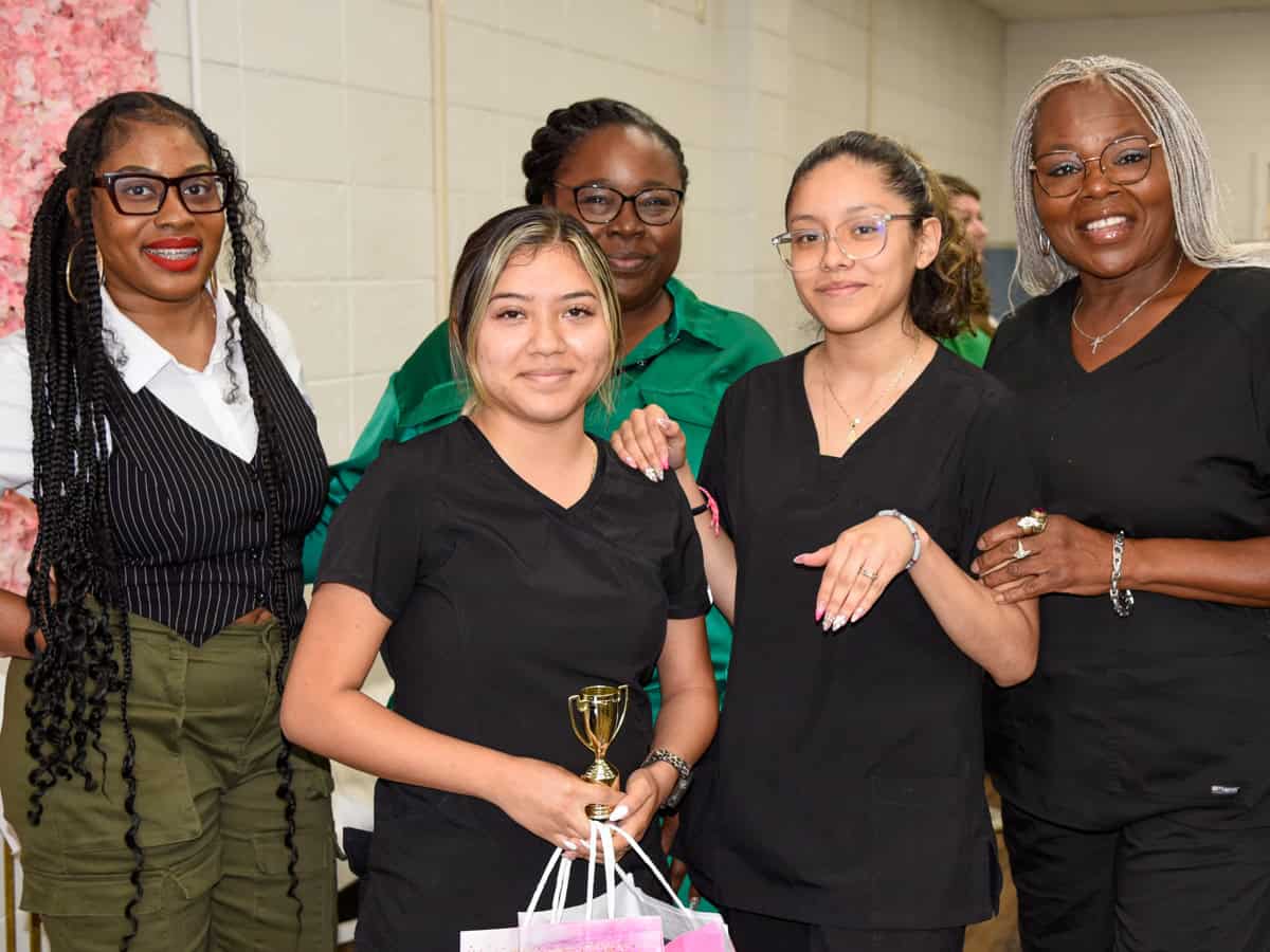Pictured are (back row, l-r) SGTC Nail Tech instructor Jessakeetha Maddox, Nail Tech Assistant Rachell Kitchens, and Cosmetology Instructor Dorothea McKenzie with the Nail Tech competition first place winner Brittany Moreno (front left) and her model.