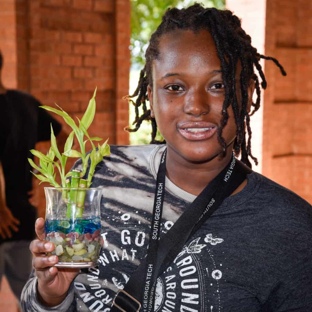 A student shows off her creation at the recent SGTC Lucky Bamboo activity.
